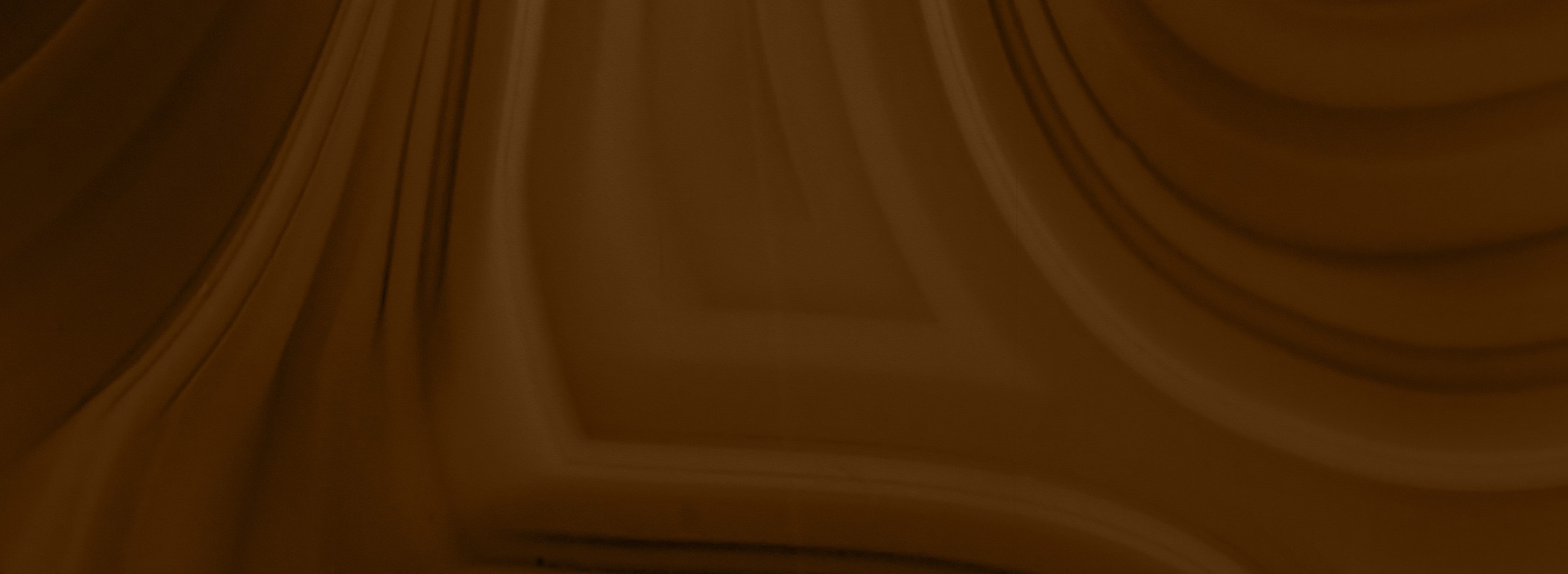 Abstract brown textured background with smooth lines.