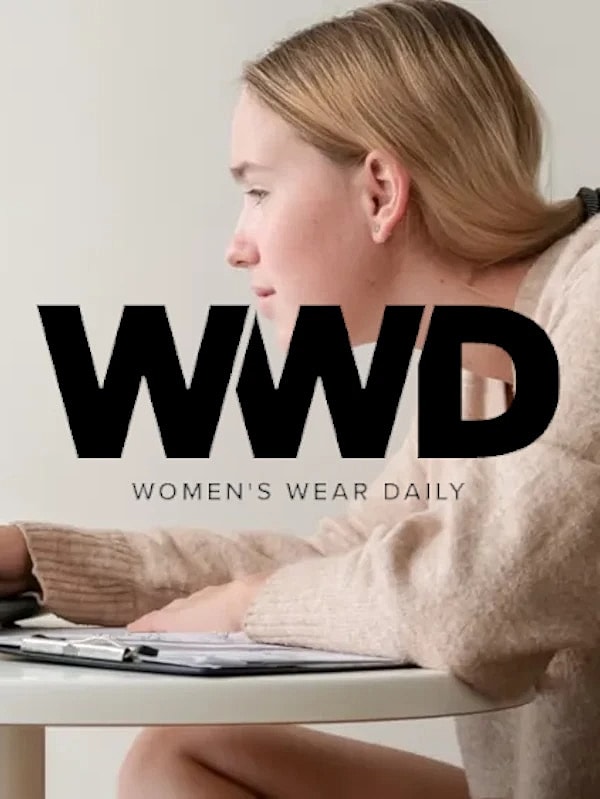 Woman working on a project at a table.