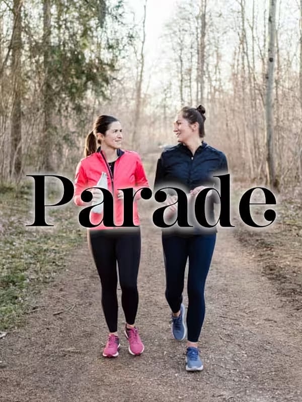 Women walking together on a nature path.