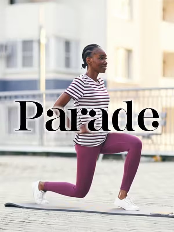Woman exercising in athletic wear on outdoor surface.
