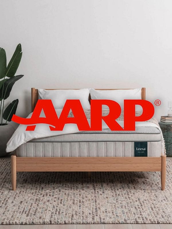 AARP branding on a stylish bed setup.