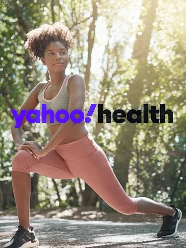 Woman stretching outdoors for fitness and wellness.