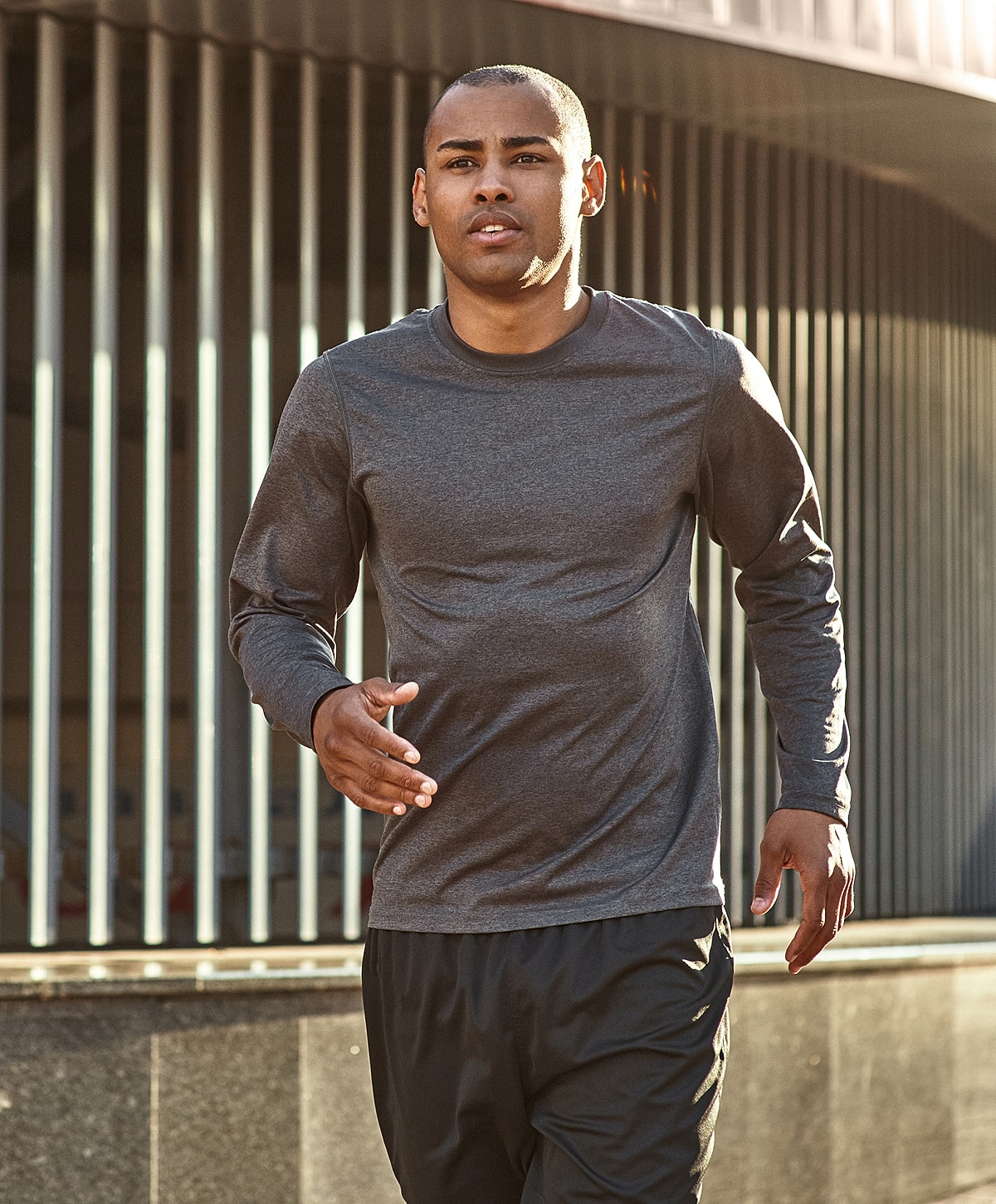 degenerative disc disease treatment patient model jogging outdoors in athletic wear.