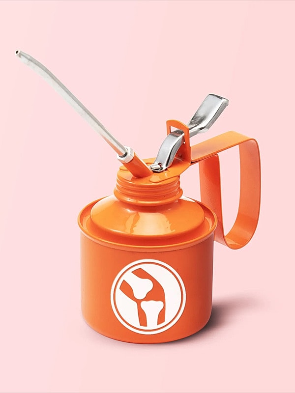 Orange oil can with spout and handle.