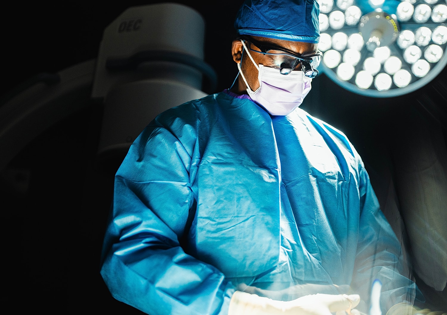 Surgeon in scrubs preparing for surgery.