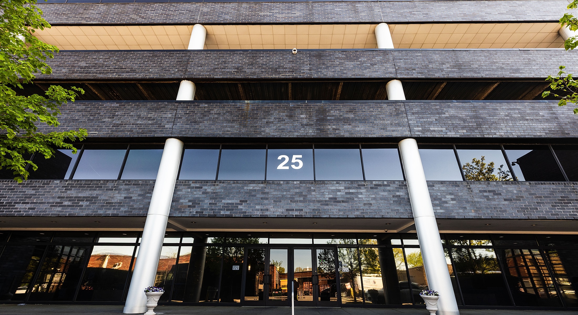 Building entrance with number 25 visible.