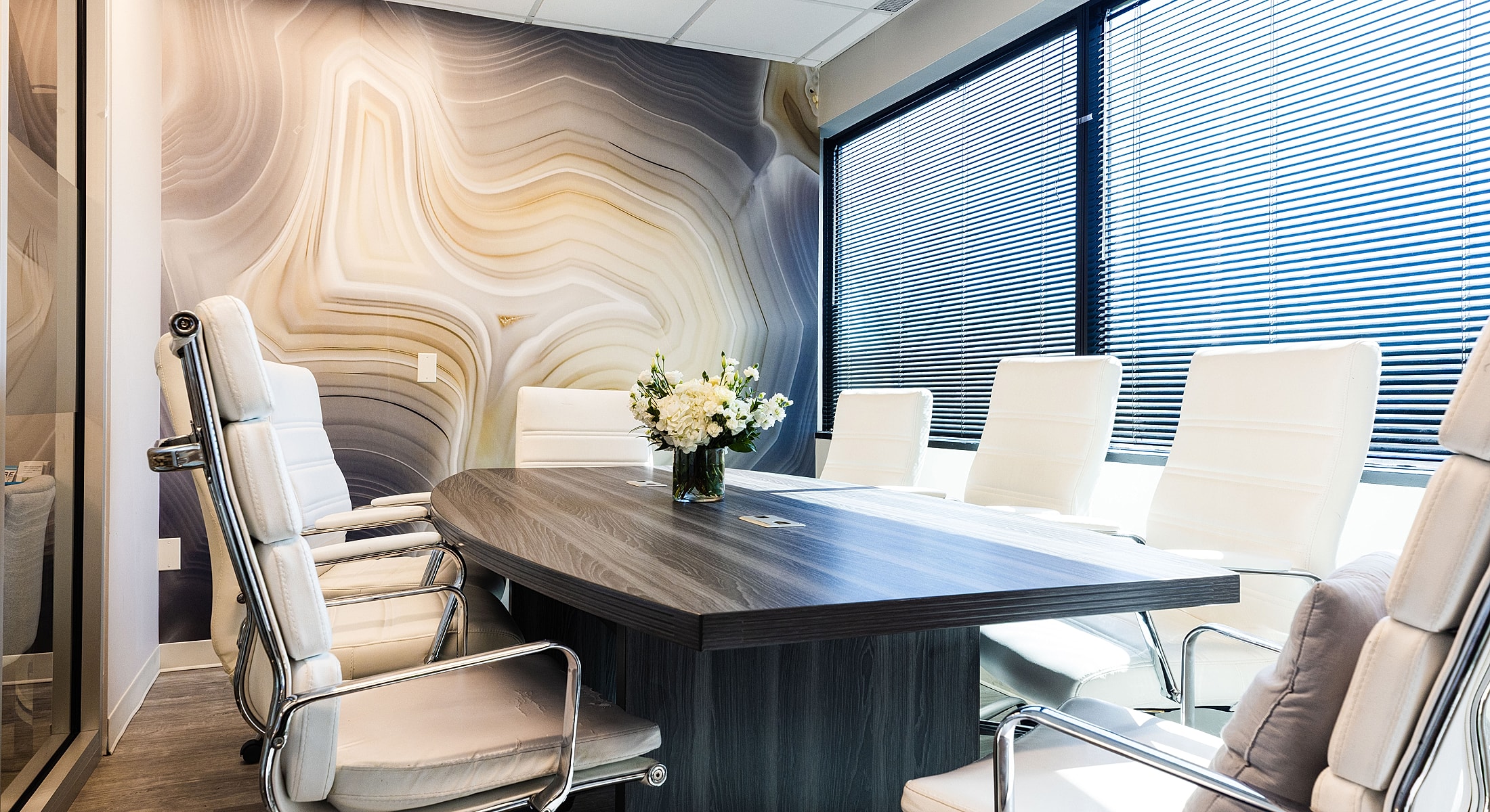 Medical office reception area with seating and decor.