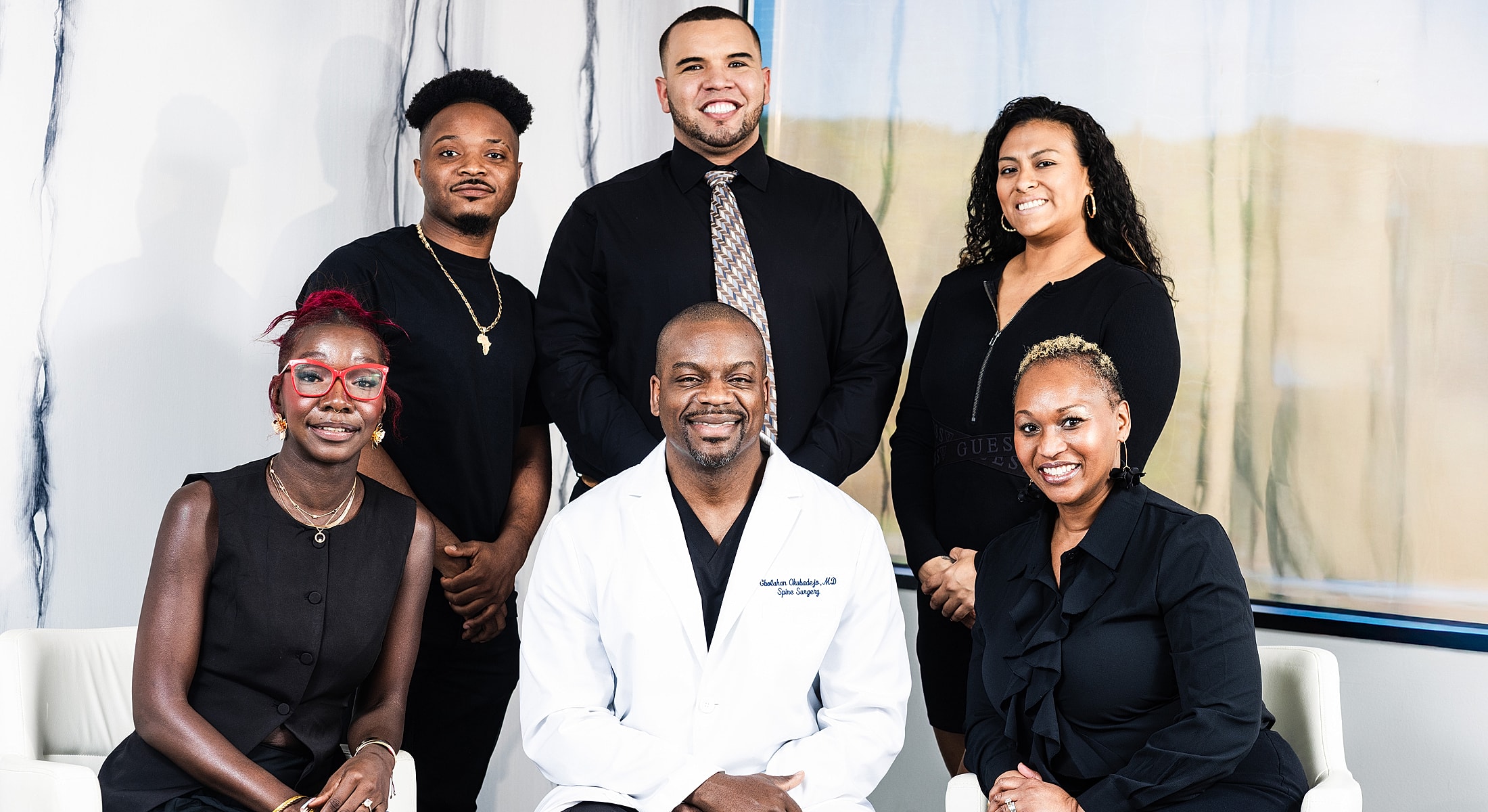 Diverse group of healthcare professionals smiling together.
